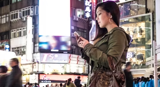 A woman being influenced by a social media influencer