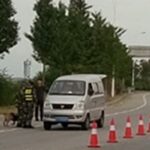 Chinese officers inspecting a car in Dandong, China