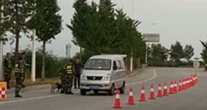 Chinese officers inspecting a car in Dandong, China