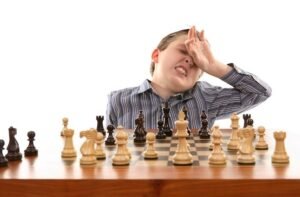 Boy making mistakes in a chess game