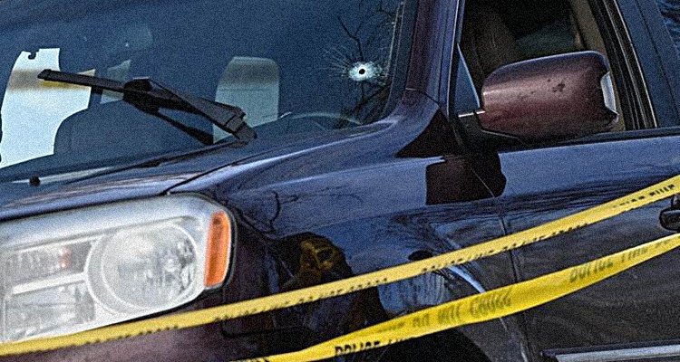 A car with a bullet hole
