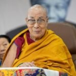 The Dalai Lama at a podium