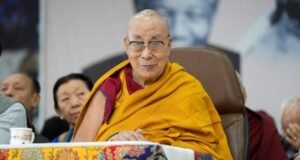 The Dalai Lama at a podium