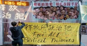 Banner saying Free All Political Prisoners