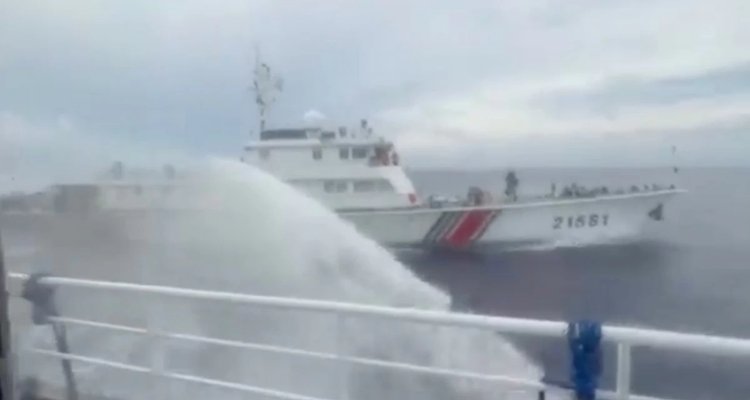 China Coast Guard vessel 21581 fires a water cannon at a Philippine vessel