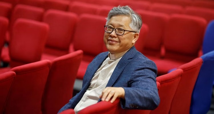 Pastor Ezra Jin Mingri looking content in 2018