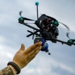 Hand and drone