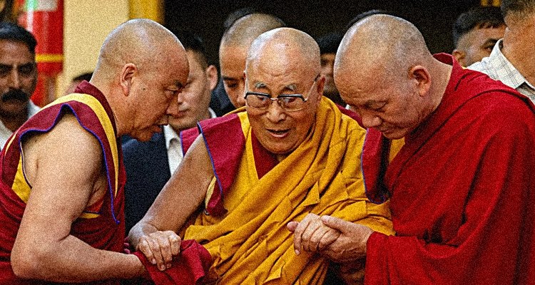 Monks assist a frail Dalai Lama